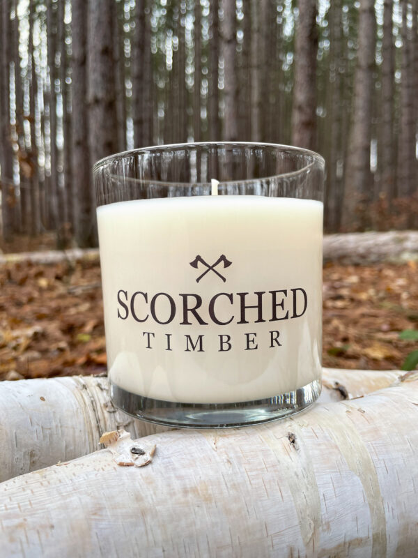 Large Scorched Timber scented candle on campfire logs